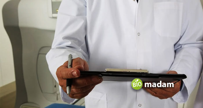 A-doctor-holding-a-pen-and-a-clipboard