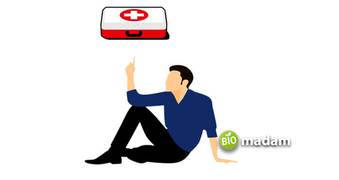 man-pointing-to-first-aid-box