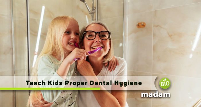 A Woman and her kid keep brushing
