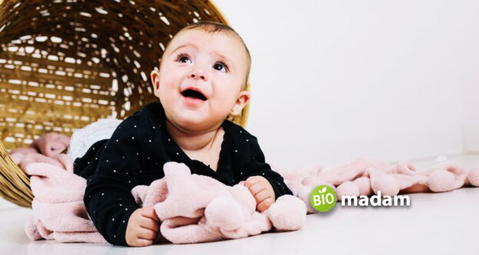 charming-baby-on-blankets-near-basket